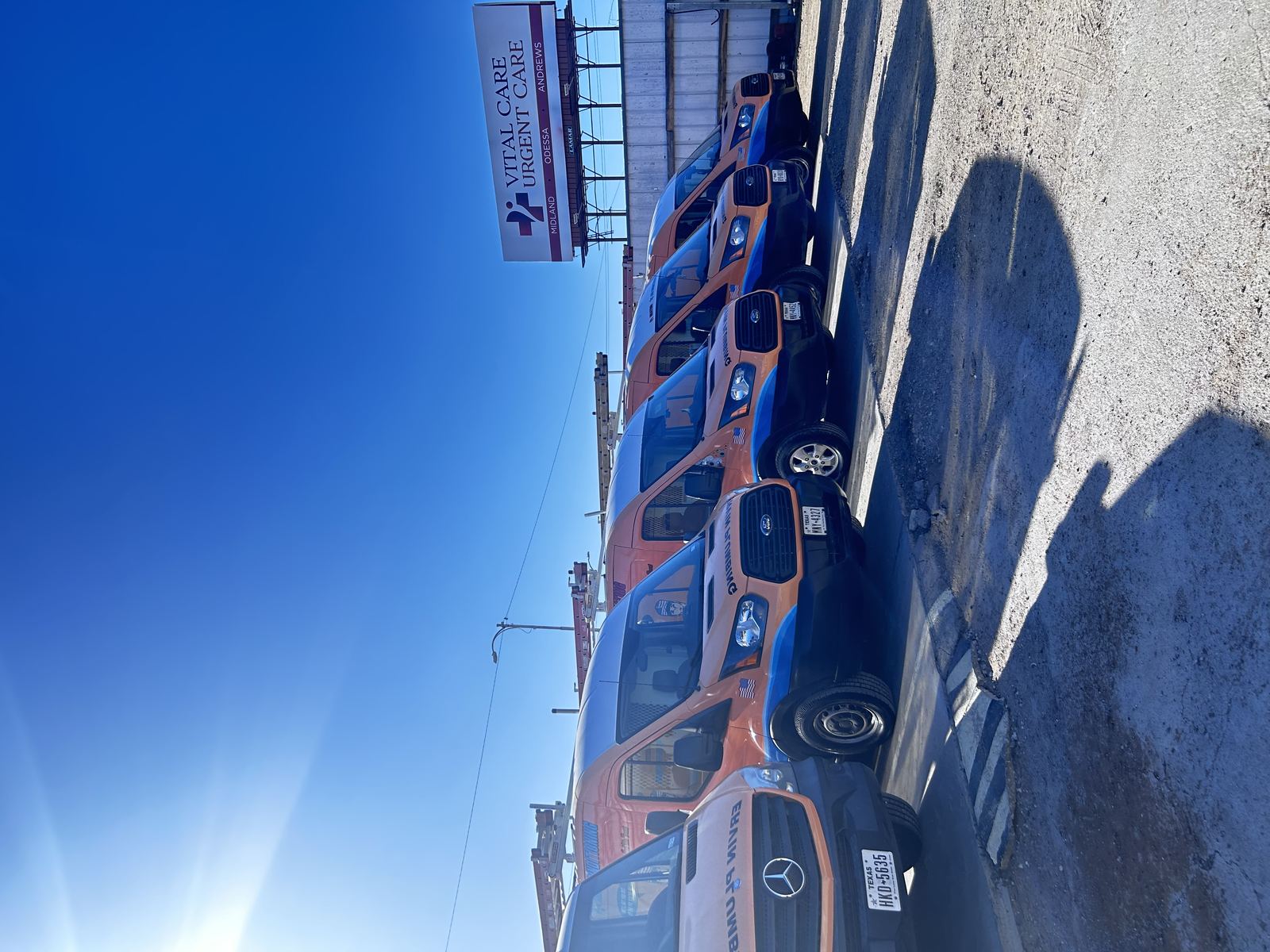 Ervin Plumbing fleet van lineup, second angle