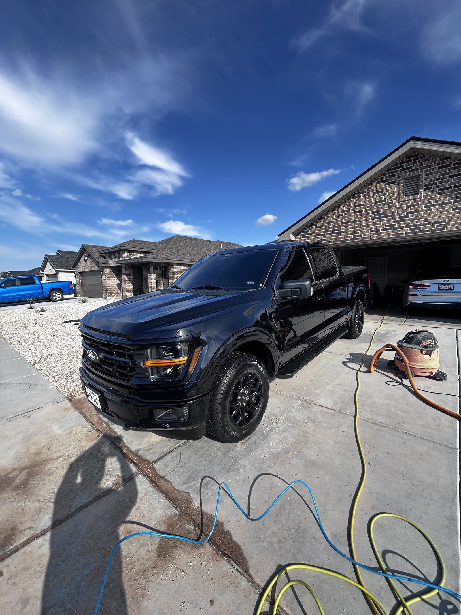 Freshly washed black Ford truck exterior detail