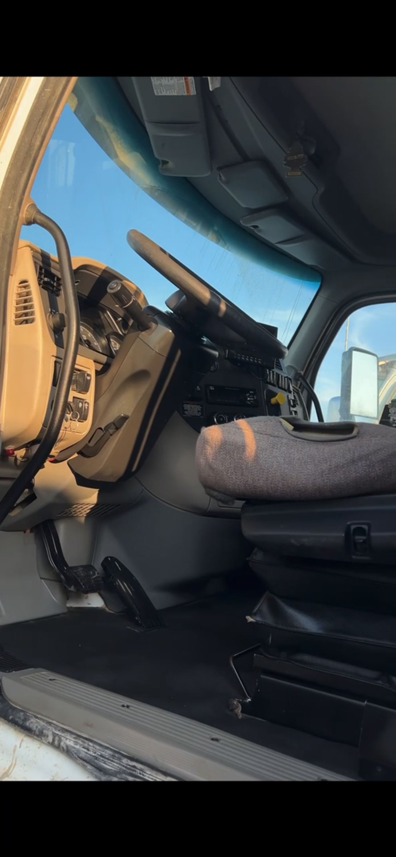 Clean semi truck cab interior after Black Label detail